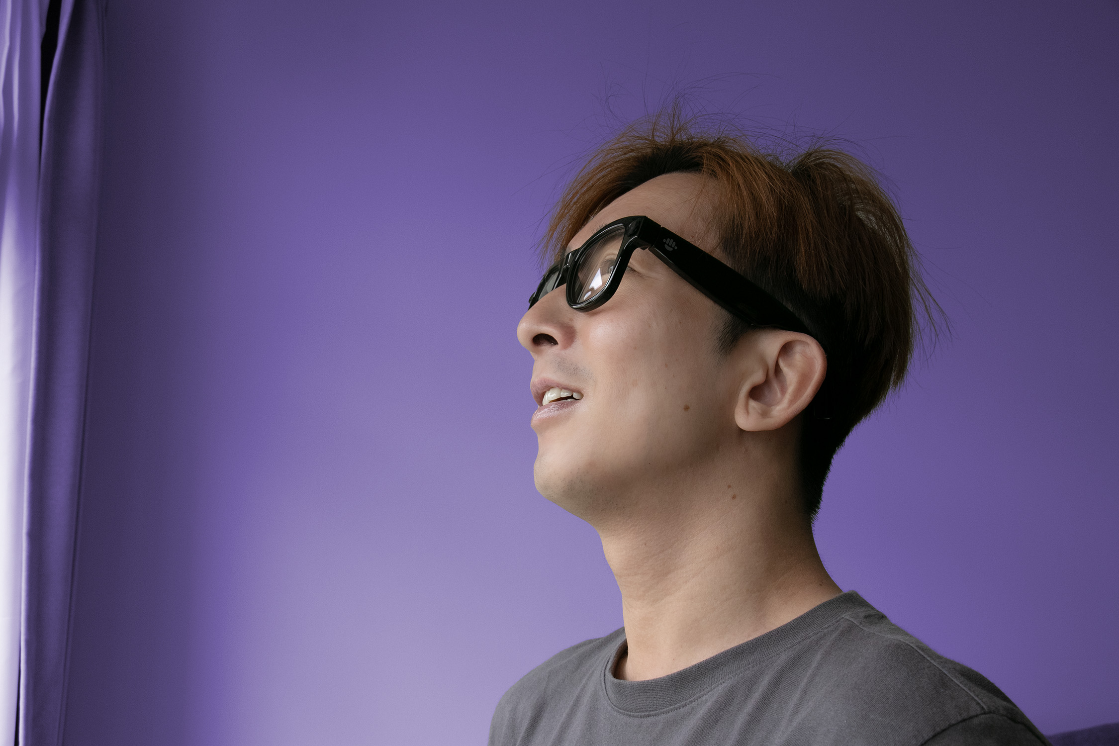Man wearing smart glasses with black rectangular frames